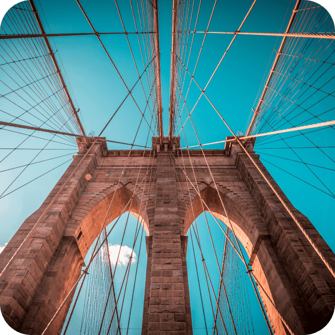 Brooklyn Bridge structural detail with blue sky background
