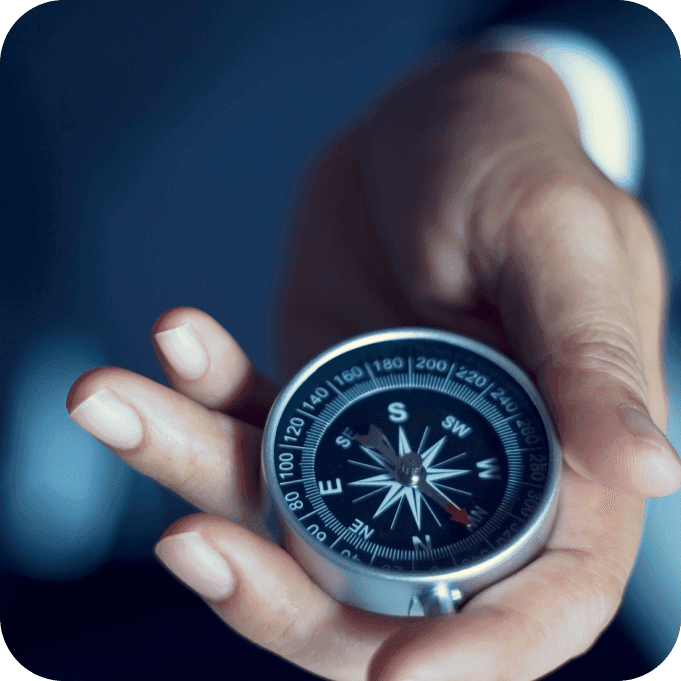 business man holding a compass
